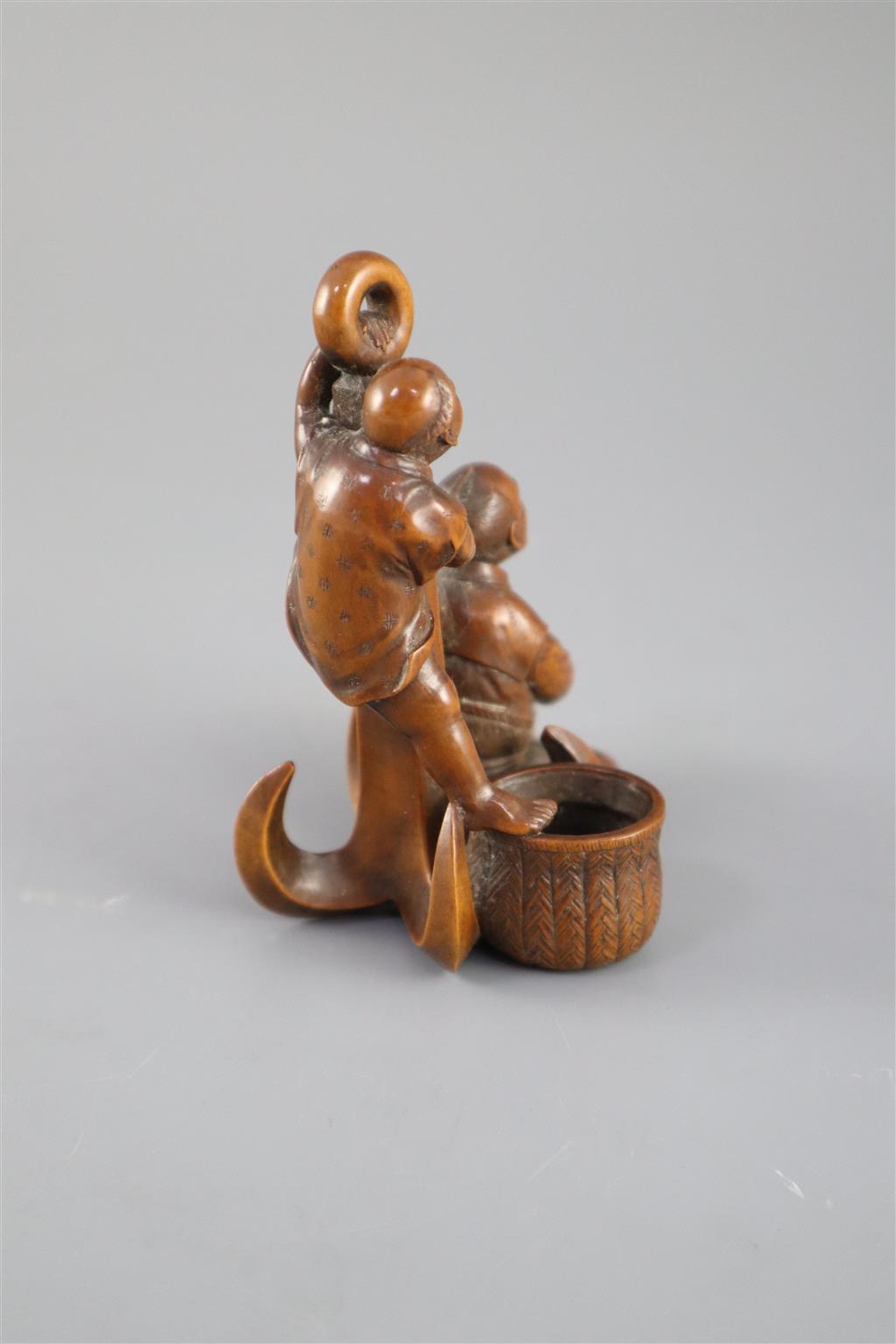 A Japanese boxwood okimono of two sailors and an anchor, Meiji period, 9.5cm high